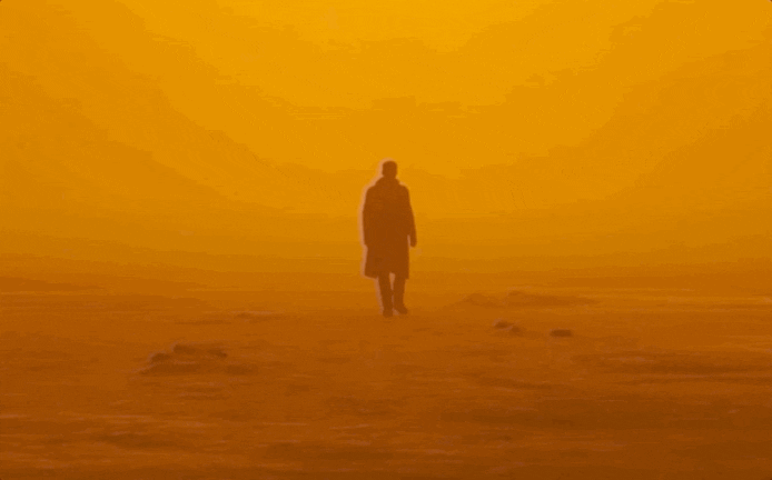 Man walking alone into a sandstorm