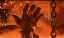 Terminator giving a thumbs up as he sinks into lava with sparks and flames
